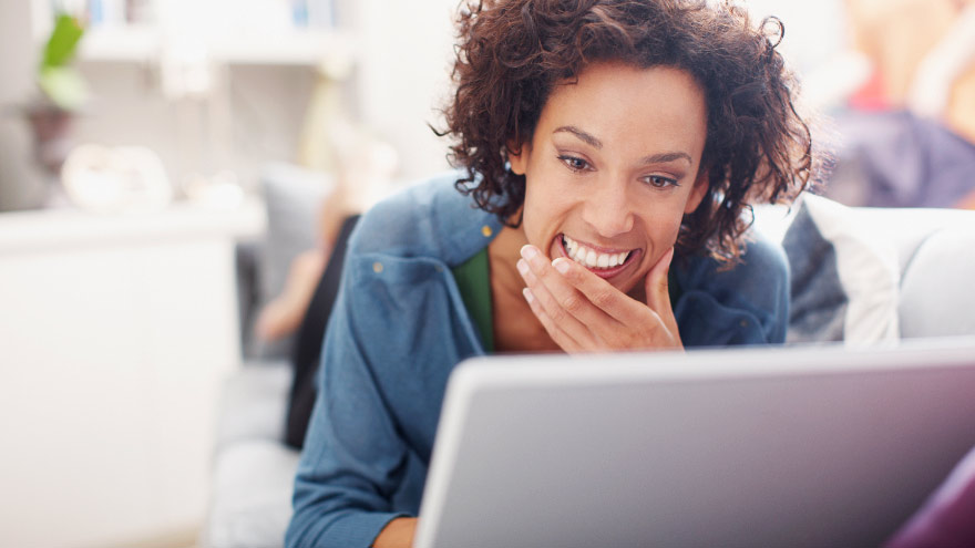 Young woman booking an online appointment on her laptop