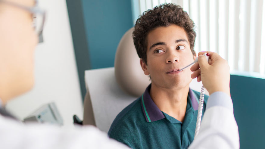 Young man receiving care at urgent care